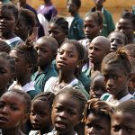 School children singing at morning assembly
