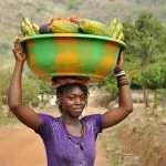 Woman carrying produce to market in Kabala, Sierra Leone