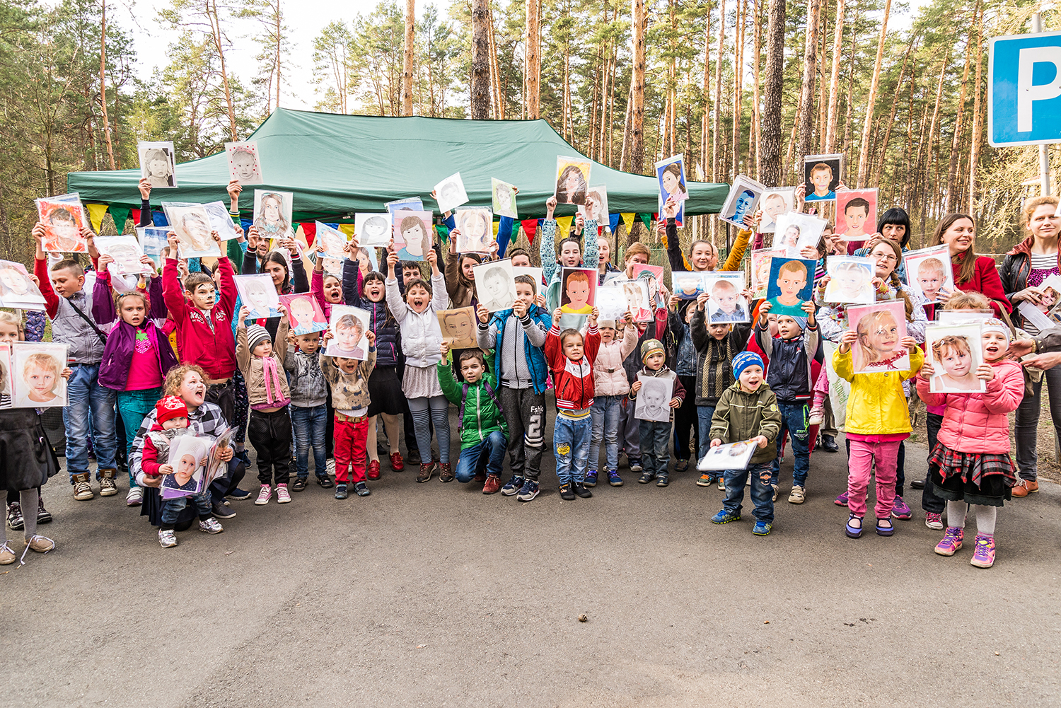 Group of children shouting a grateful "Дякую" (thank you) in Ukranian